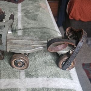 Vintage Metal Roller Skates with Leather Straps